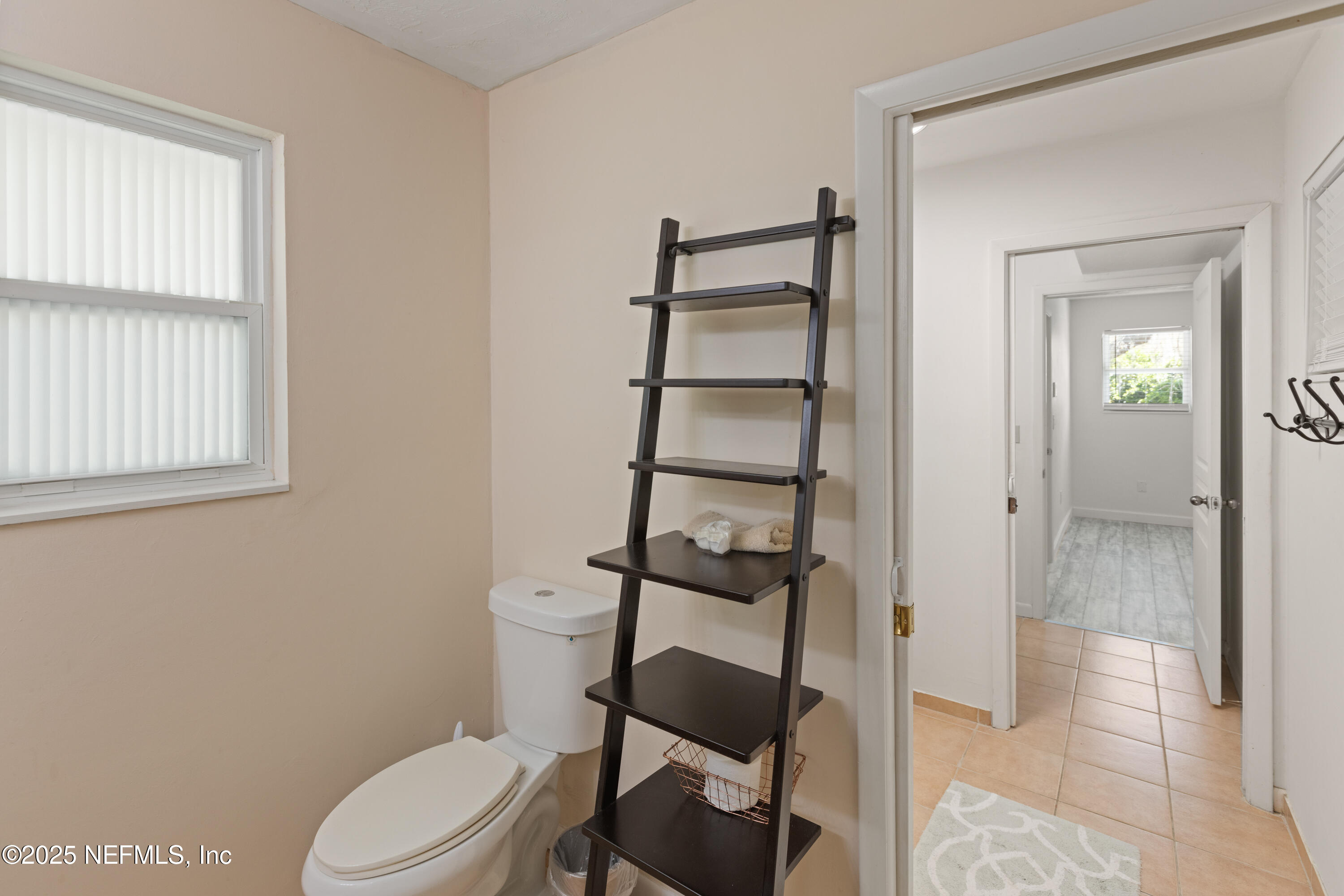 303 Southeast 3rd Avenue Melrose, FL 32666 - Photo 38 of 90 a white toilet sitting next to a bathroom sink