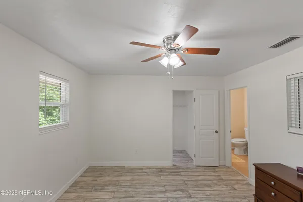 a view of a porch with wooden floor and stairs