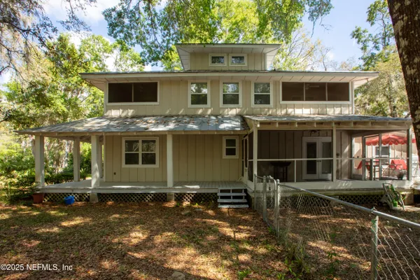 a view of house with yard in background