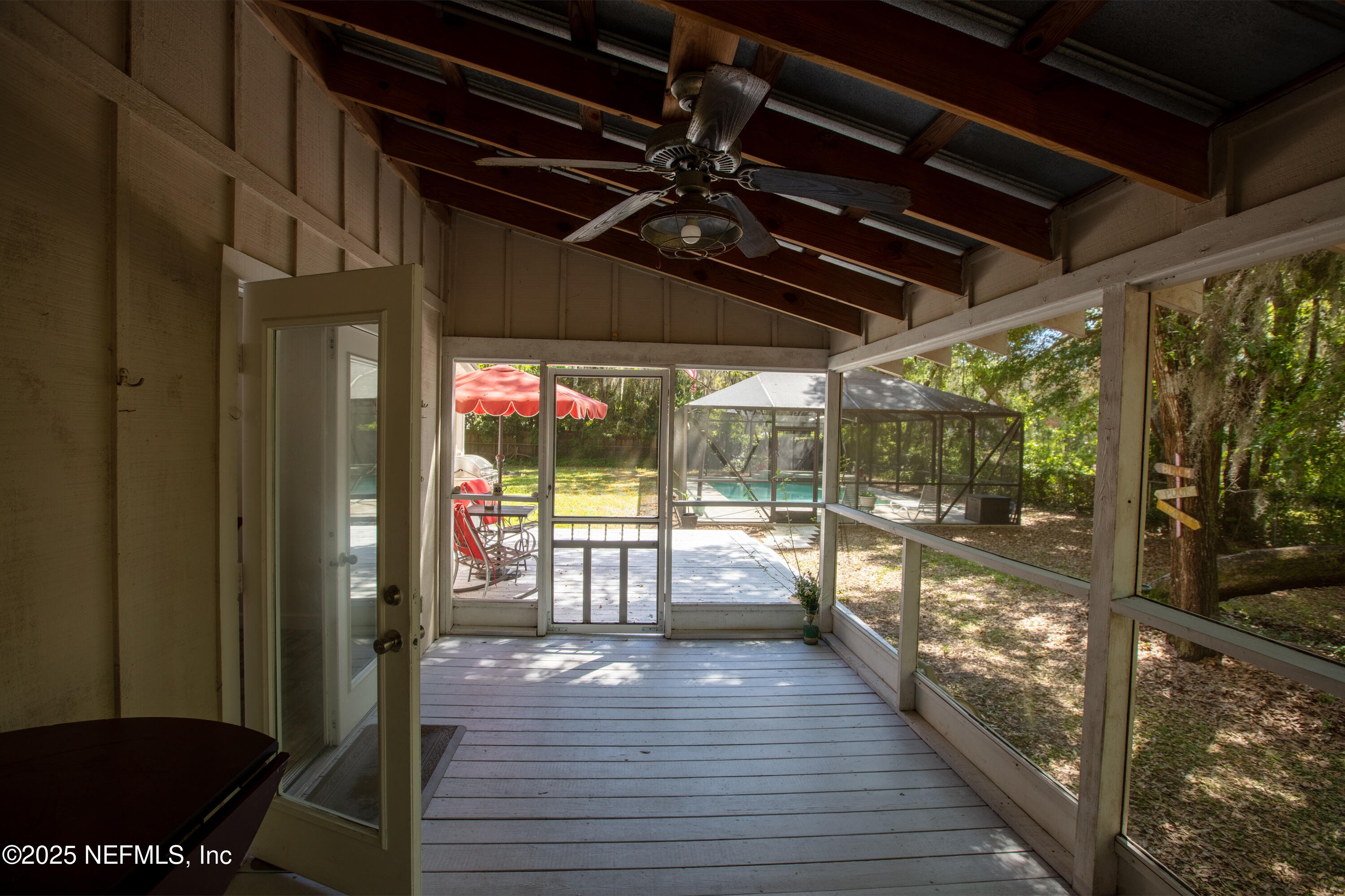 303 Southeast 3rd Avenue Melrose, FL 32666 - Photo 53 of 90 a view of a porch with wooden floor