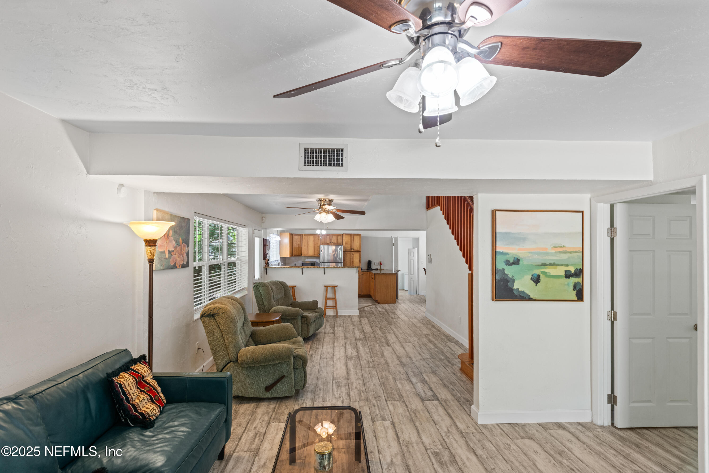 303 Southeast 3rd Avenue Melrose, FL 32666 - Photo 7 of 90 a living room with furniture and wooden floor