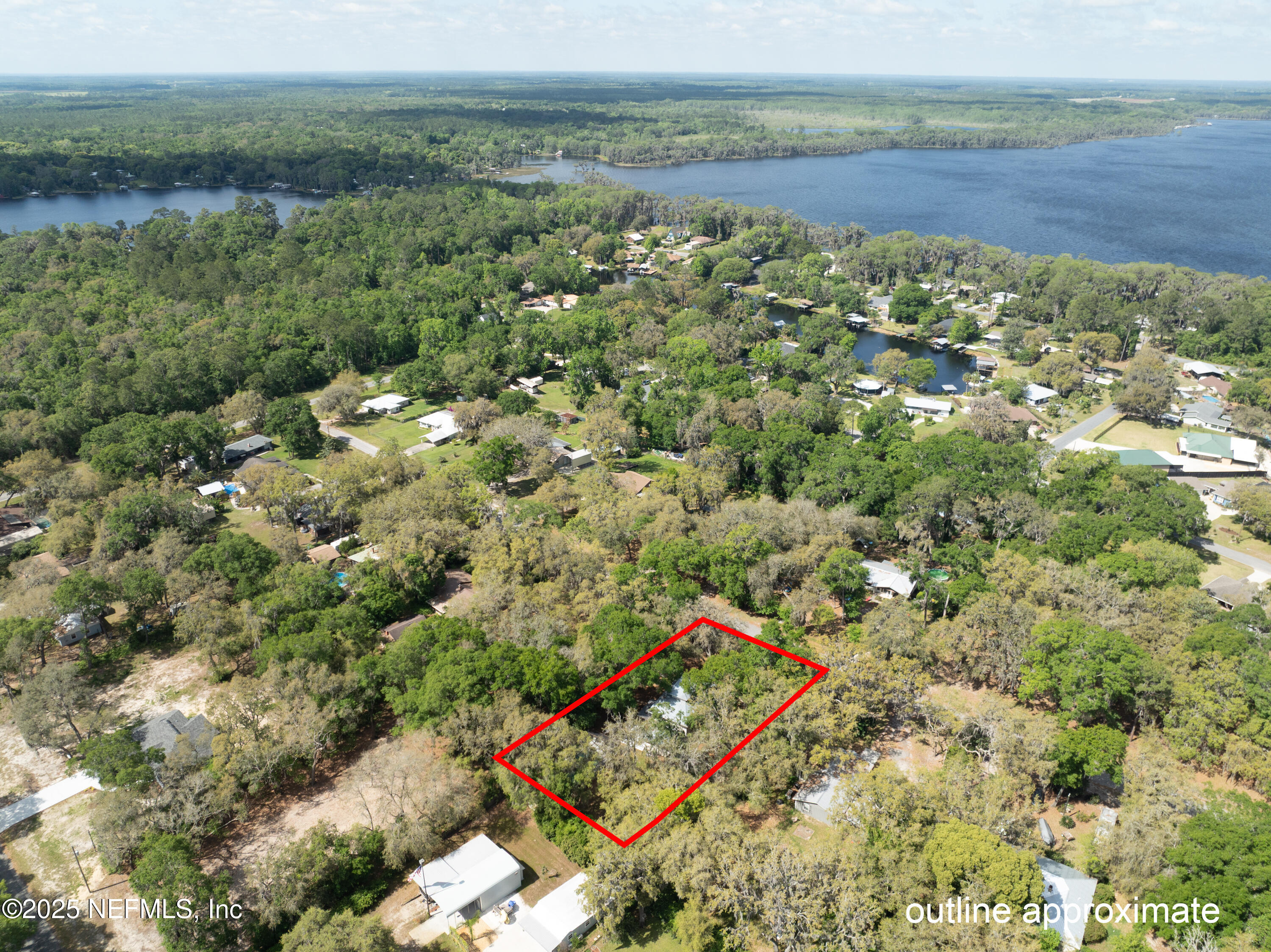 303 Southeast 3rd Avenue Melrose, FL 32666 - Photo 77 of 90 an aerial view of a house with a yard