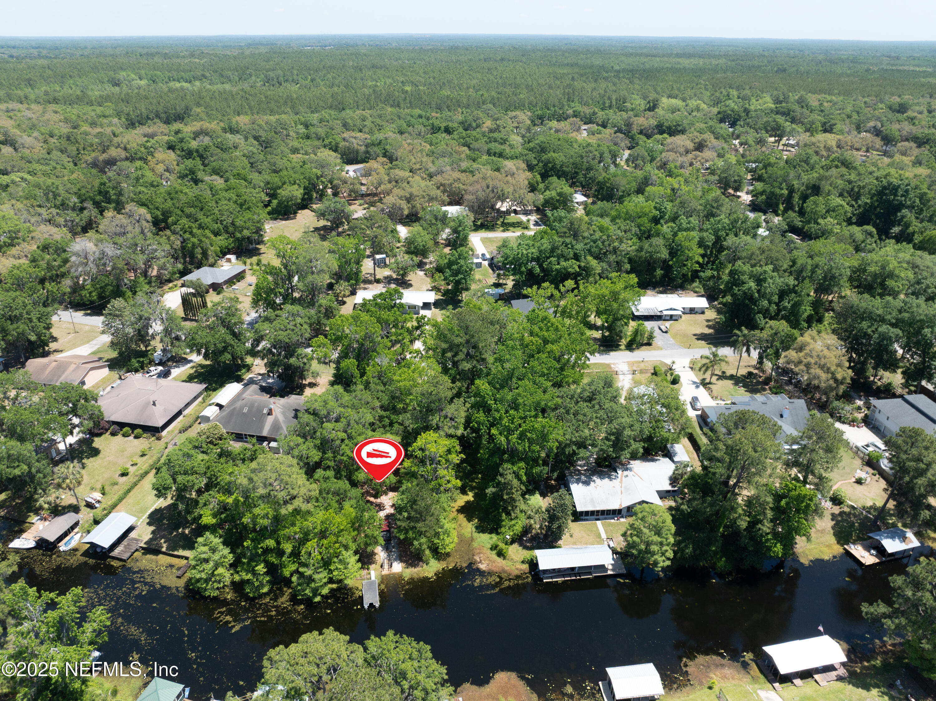 303 Southeast 3rd Avenue Melrose, FL 32666 - Photo 88 of 90 an aerial view of residential houses with outdoor space and trees
