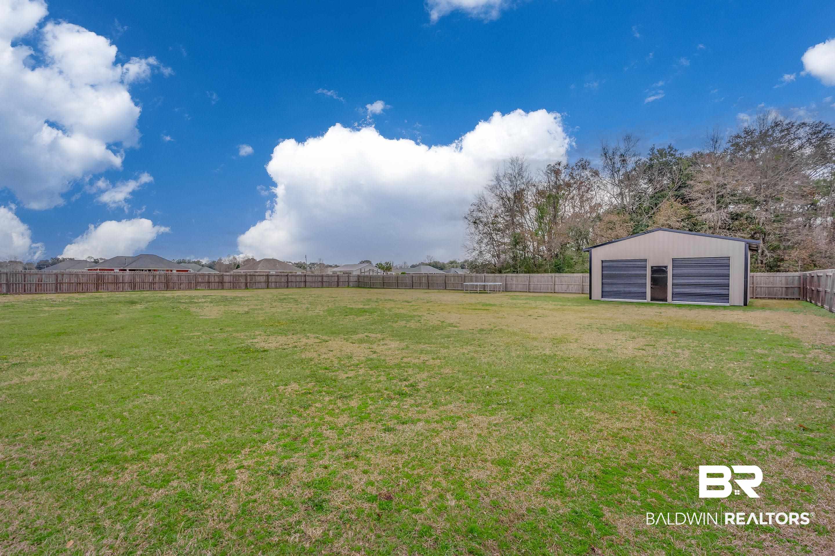 13235 Tom Gaston Road Mobile, AL 36695 - Photo 25 of 43 View of yard featuring an outbuilding