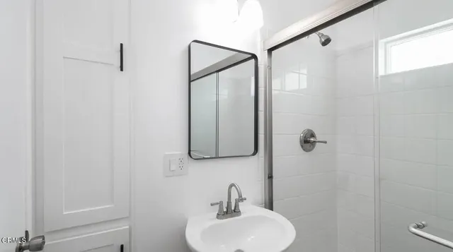 a bathroom with a sink and mirror