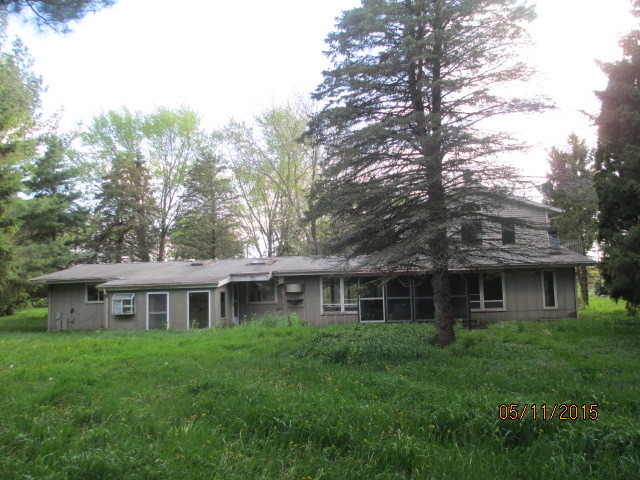 16110 Green Road Harvard, IL 60033 - Photo 4 of 10 a front view of a house with a garden