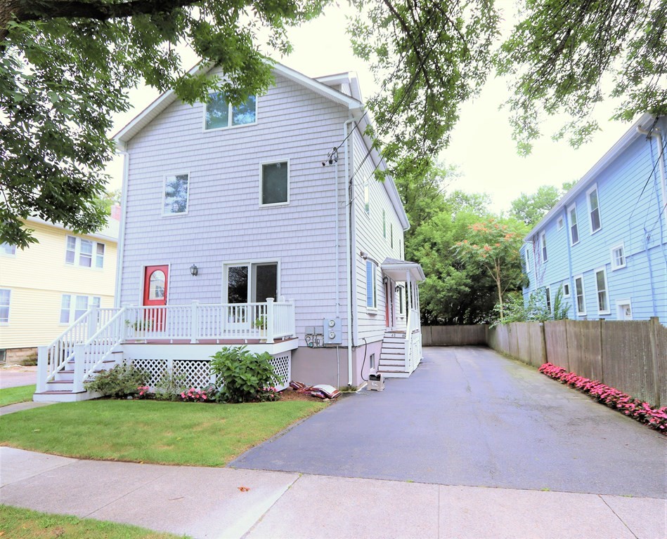 60 Margaret Street, Unit R Arlington, MA 02474 - Photo 1 of 1 a front view of house with yard and green space
