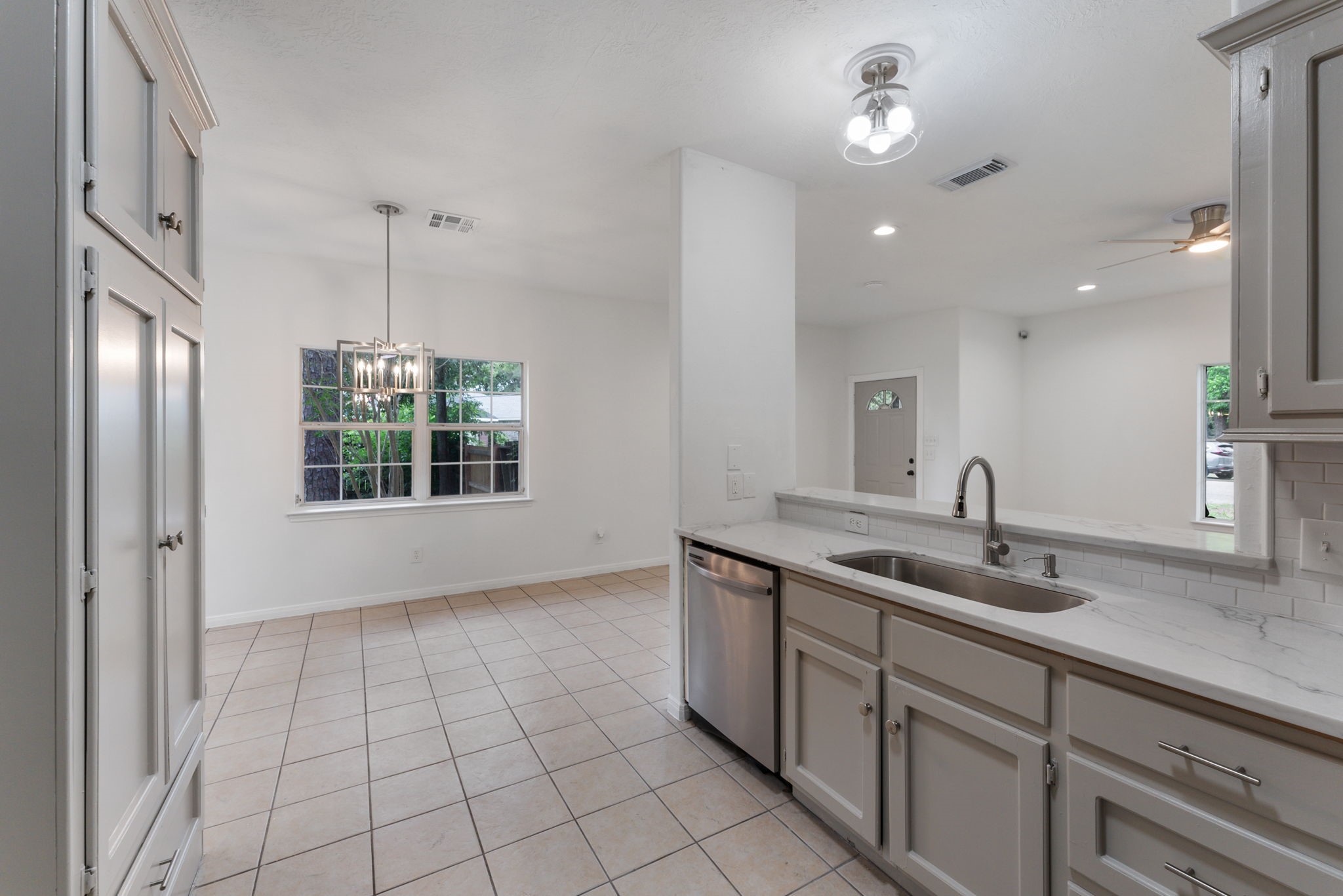 92 Tupelo Lane Conroe, TX 77304 - Photo 13 of 21 a kitchen with a sink and cabinets