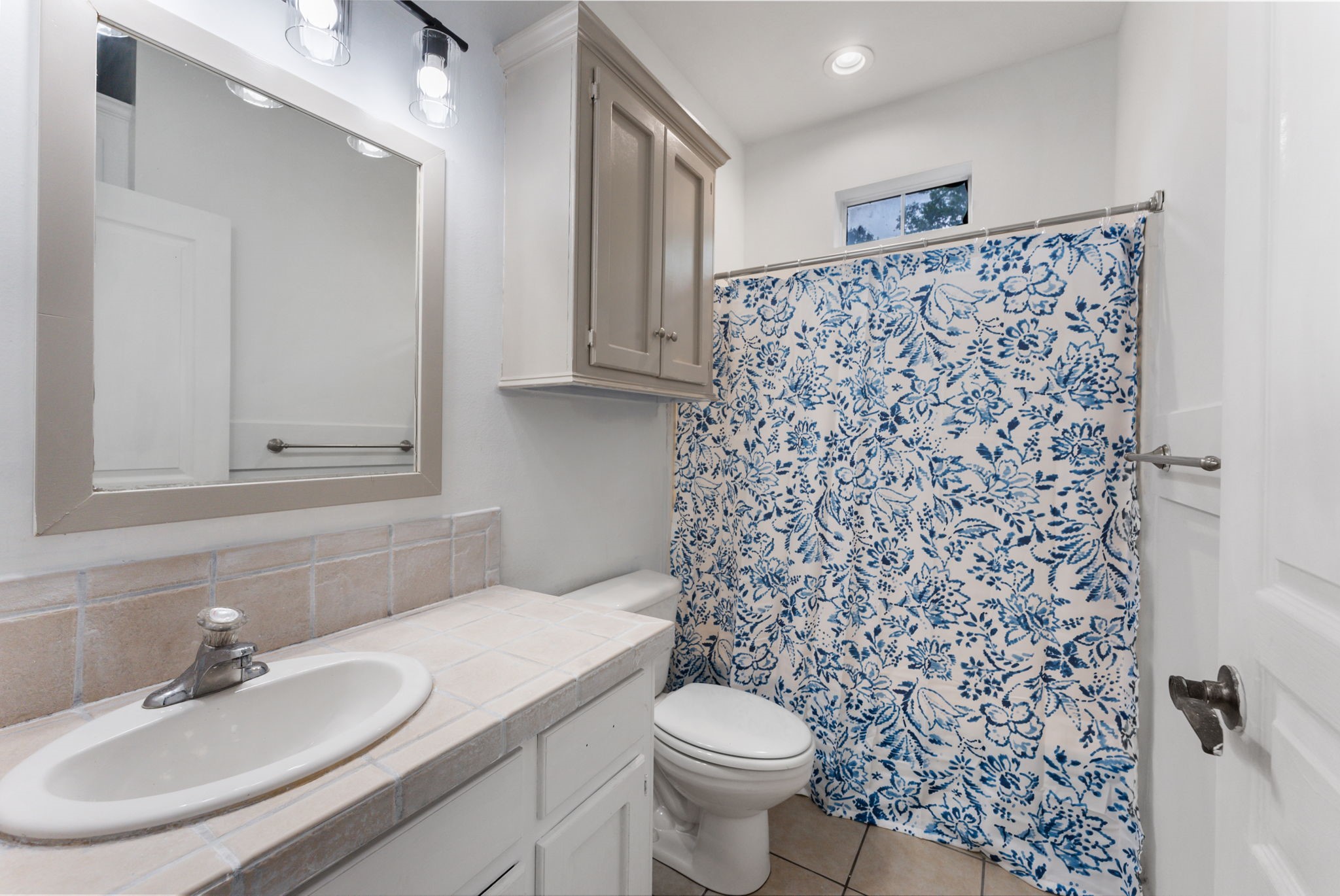92 Tupelo Lane Conroe, TX 77304 - Photo 18 of 21 a bathroom with a sink toilet and shower