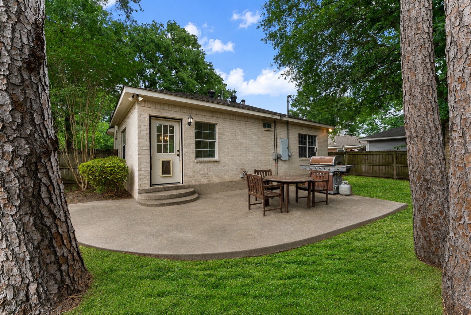 92 Tupelo Lane Conroe, TX 77304 - Photo 20 of 21 a view of a house with backyard and sitting area