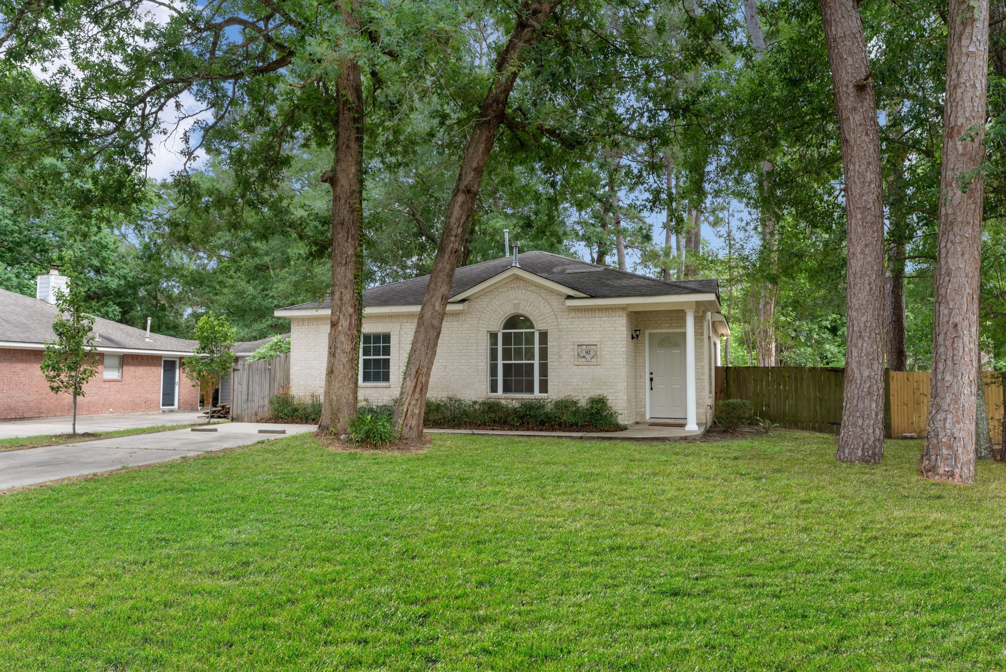 92 Tupelo Lane Conroe, TX 77304 - Photo 2 of 21 a view of a house with a yard