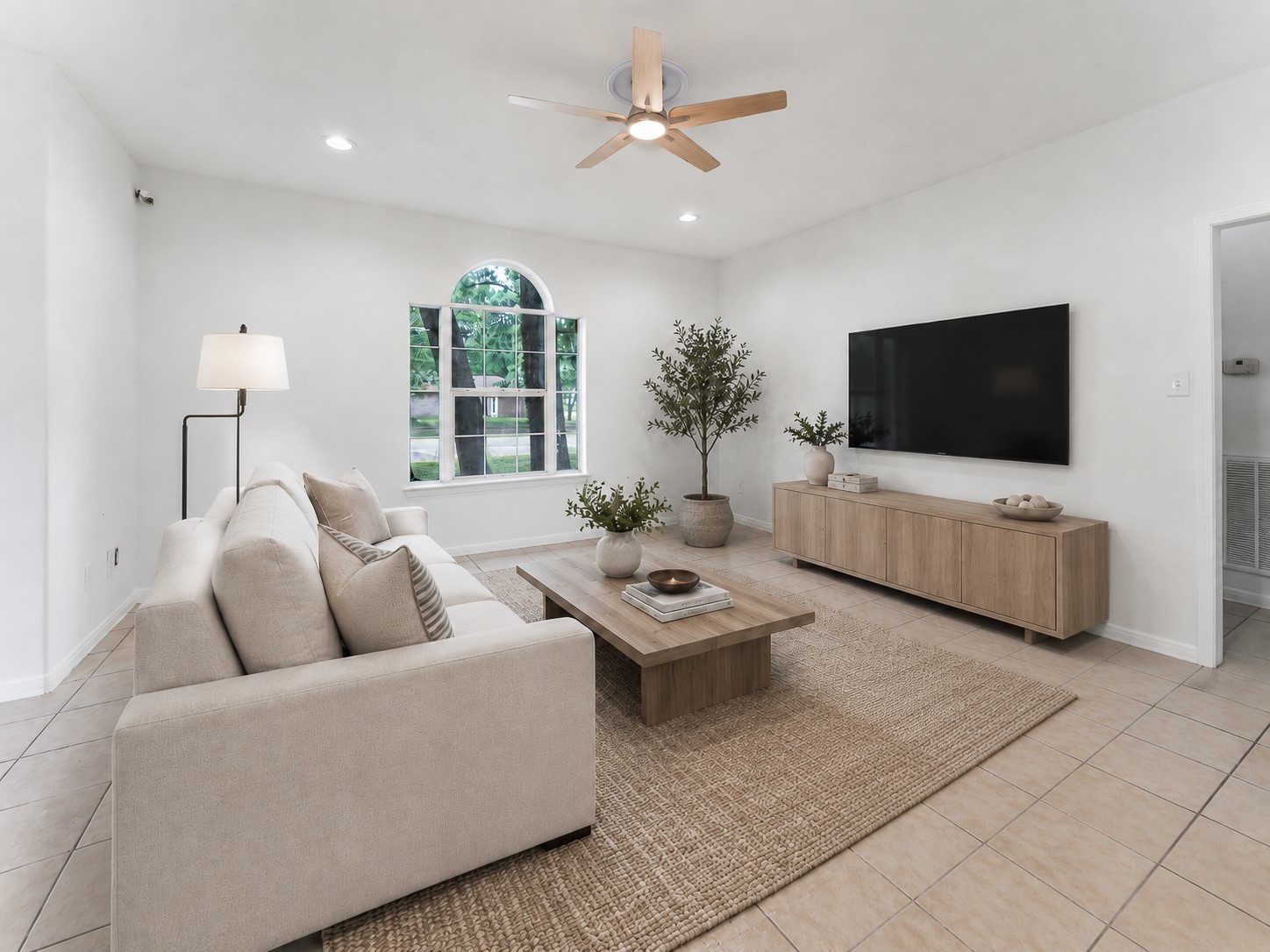 92 Tupelo Lane Conroe, TX 77304 - Photo 7 of 21 a living room with furniture and a flat screen tv