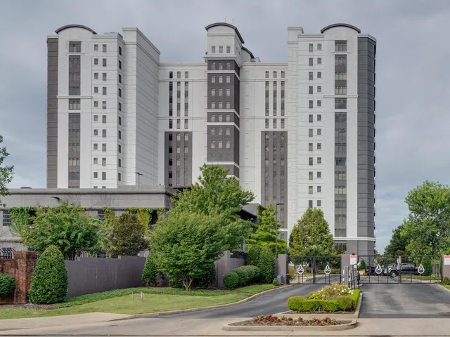 a front view of a building with potted plants