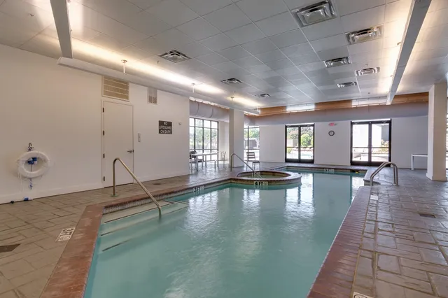 a view of a hall with a swimming pool