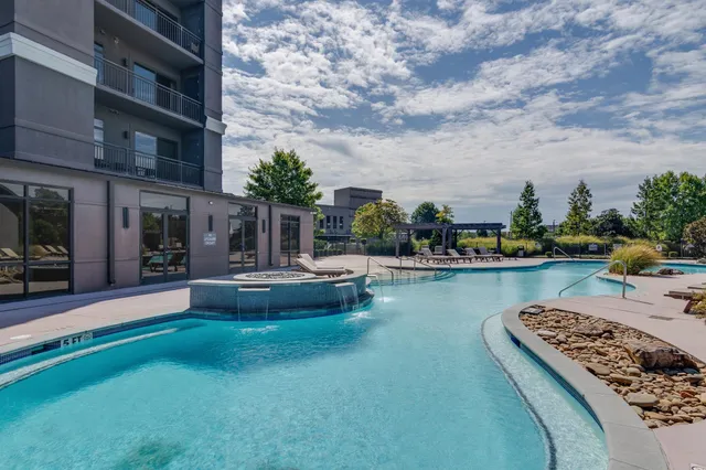 a view of a swimming pool with a patio