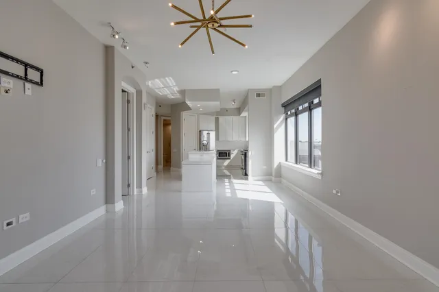 a kitchen with stainless steel appliances granite countertop a sink and a stove