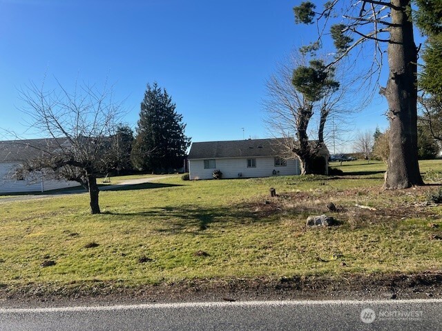 8885 Line Road Lynden, WA 98264 - Photo 3 of 7 a view of a yard with wooden fence