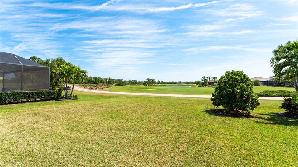 4511 Terrazza Court Lakewood Ranch, FL 34211 - Photo 28 of 65 a view of a swimming pool and an outdoor seating