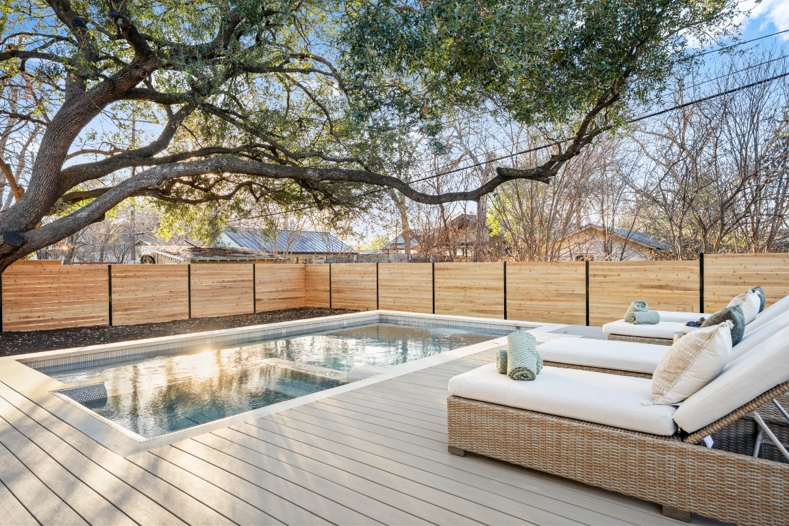 7706 Rutgers Avenue Austin, TX 78757 - Photo 18 of 35 a view of a swimming pool with a patio