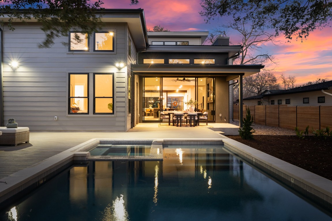 7706 Rutgers Avenue Austin, TX 78757 - Photo 2 of 35 a view of a patio with swimming pool table and chairs