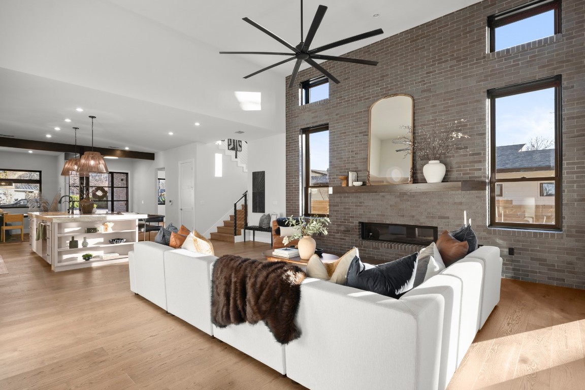 7706 Rutgers Avenue Austin, TX 78757 - Photo 27 of 35 a living room with furniture and a fireplace