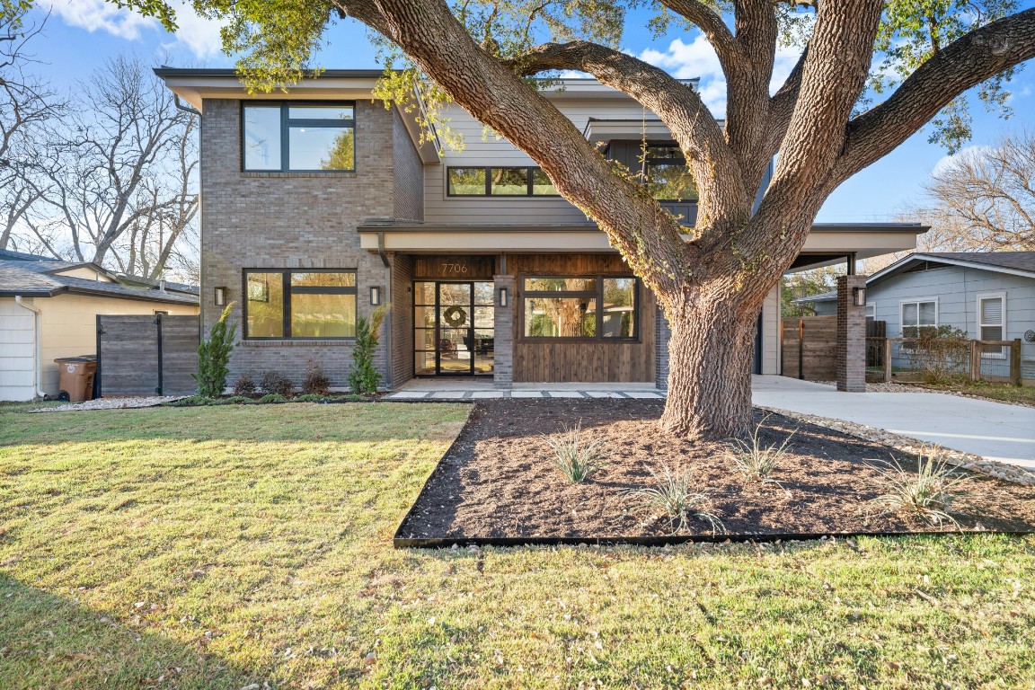 7706 Rutgers Avenue Austin, TX 78757 - Photo 34 of 35 a front view of a house with a yard