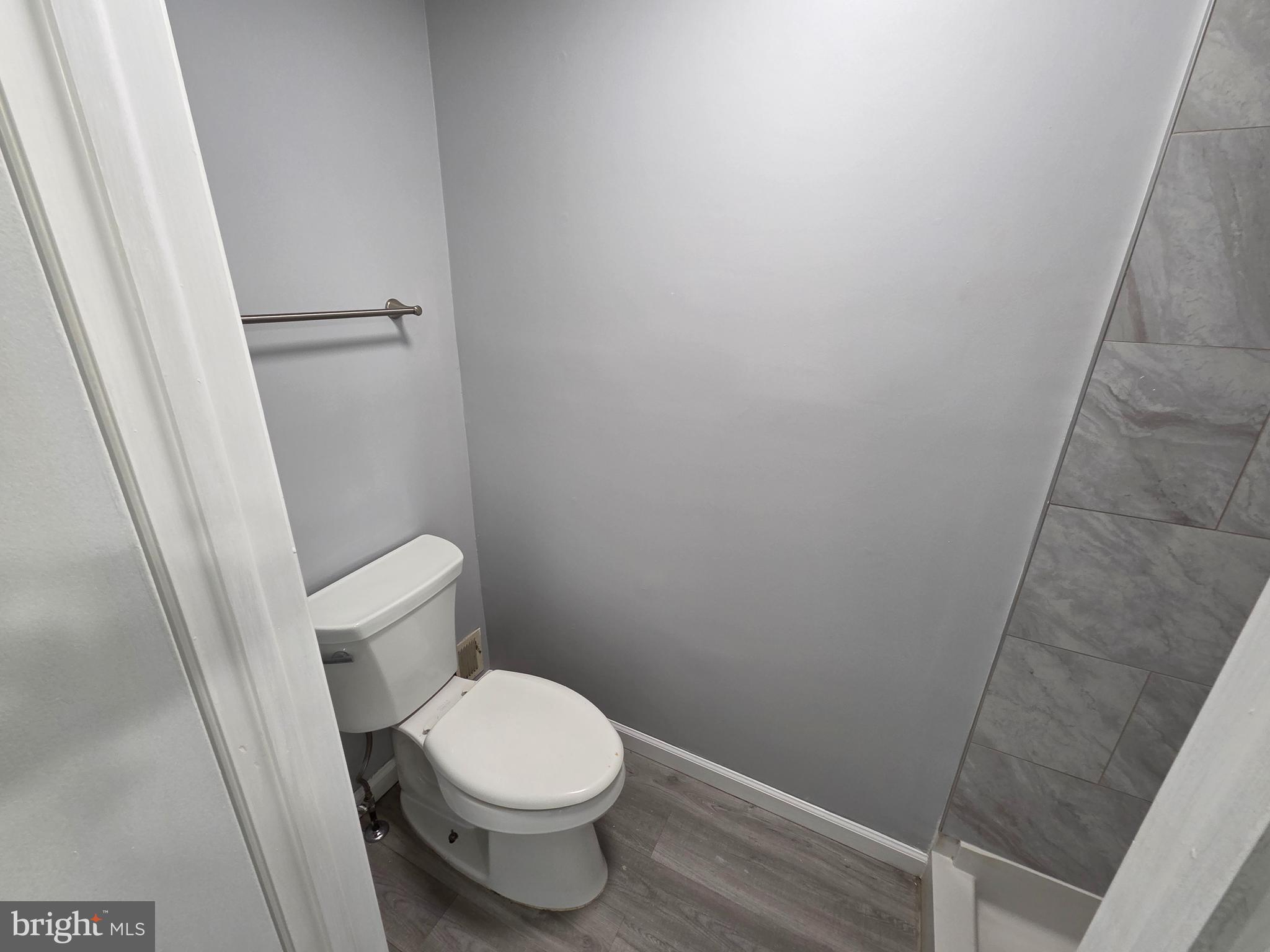 17923 Ashton Club Way Ashton, MD 20861 - Photo 12 of 21 a white toilet sitting next to a shower