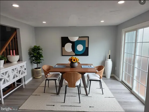 a view of a livingroom with furniture and a flat screen tv