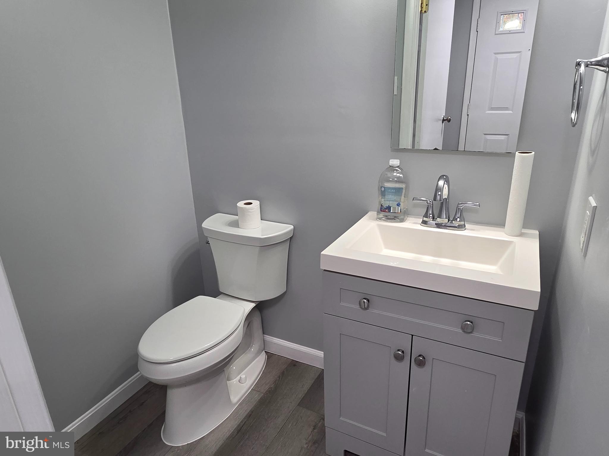 17923 Ashton Club Way Ashton, MD 20861 - Photo 6 of 21 a bathroom with a toilet sink and mirror