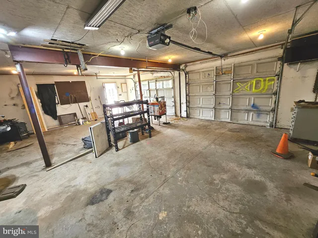 a view of a field with trees in the background