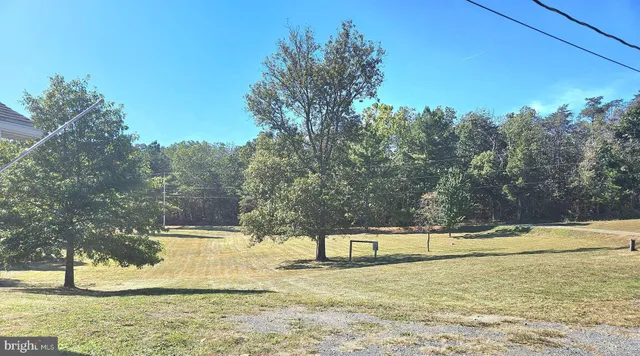 a view of kitchen with furniture and refrigerator