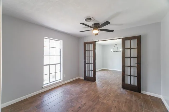 a view of an empty room with a window