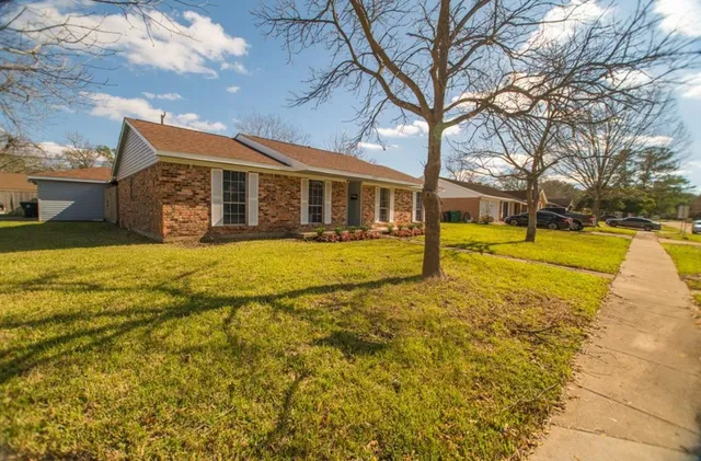 a kitchen with stainless steel appliances kitchen island granite countertop a stove sink and microwave