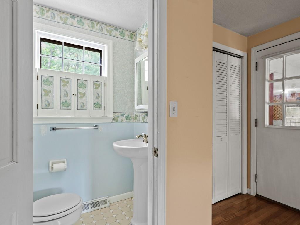 14 Lewis Road Foxboro, MA 02035 - Photo 8 of 27 a bathroom with a toilet a sink and a window