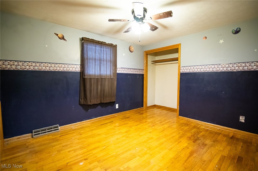 91 Mike Street Washington, WV 26181 - Photo 23 of 42 Unfurnished bedroom featuring ceiling fan and wood finished floors