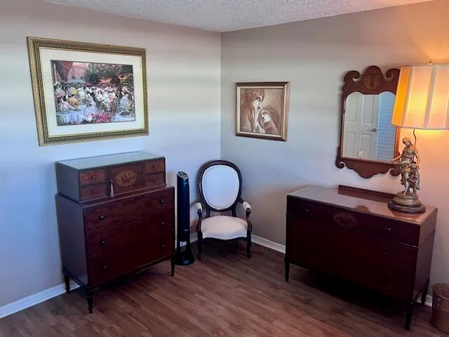 a living room with furniture and a mirror