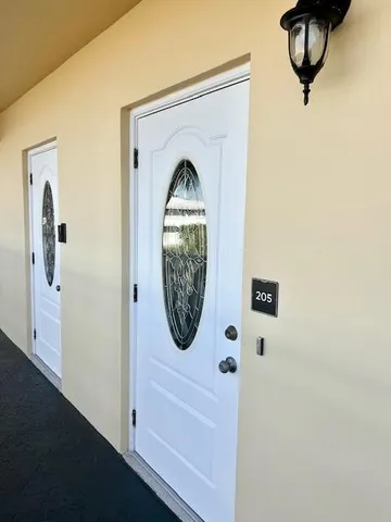 a front view of a house with washer and dryer