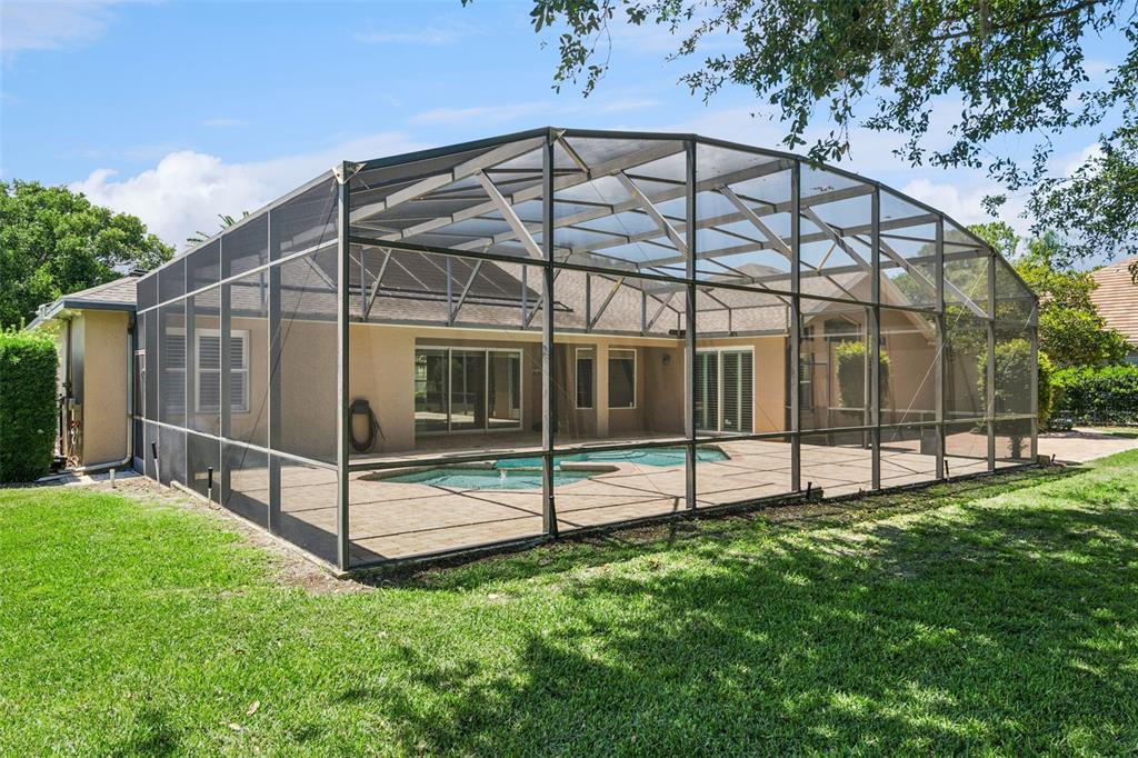 2230 Ridgewind Way Windermere, FL 34786 - Photo 37 of 38 a view of a backyard with a garden and deck