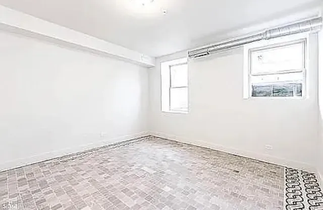 a view of a room that has a window in it