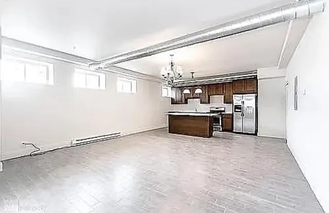 a view of a kitchen with furniture and a window