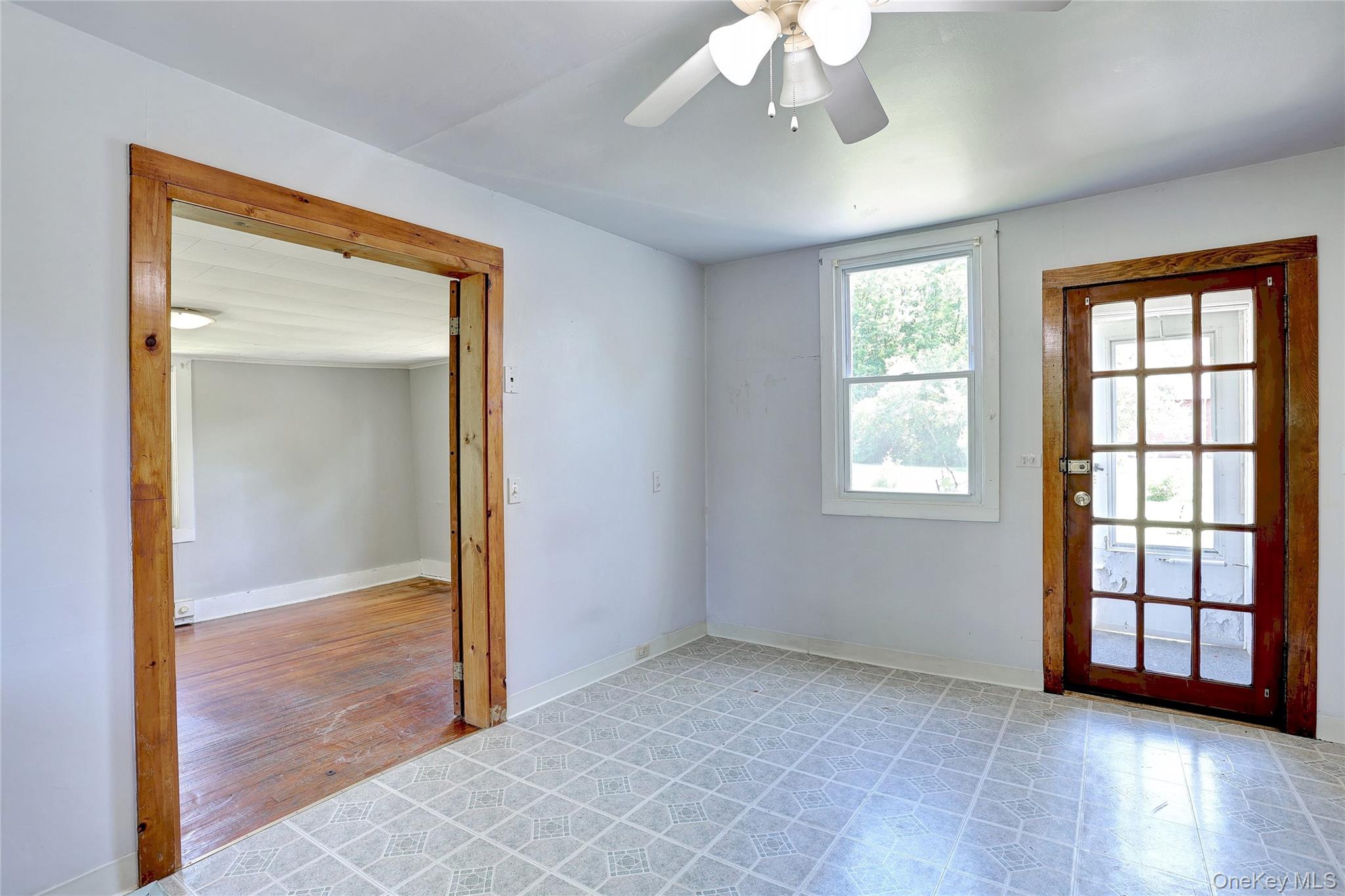 500 Haverstraw Road Suffern, NY 10901 - Photo 15 of 36 a view of an empty room with wooden floor and a window