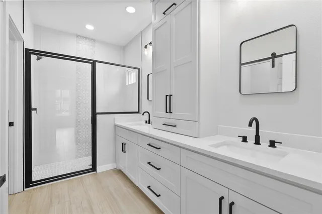 a bathroom with a bathtub and shower