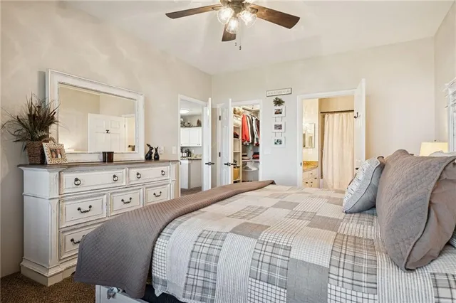 a bed room with a bed and a mirror