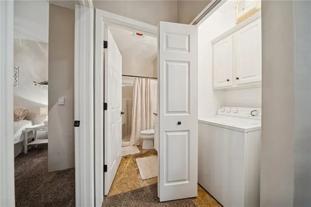a view of a hallway with closet and wooden floor