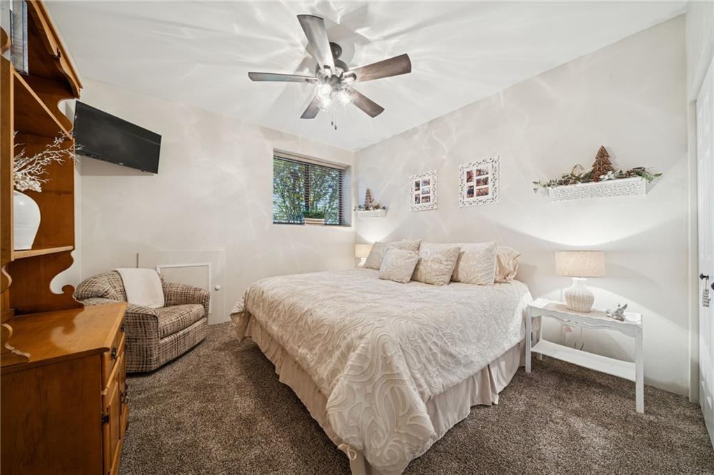 5023 Summit View Court Hidden Valley, PA 15502 - Photo 21 of 41 a bedroom with a bed and a chandelier