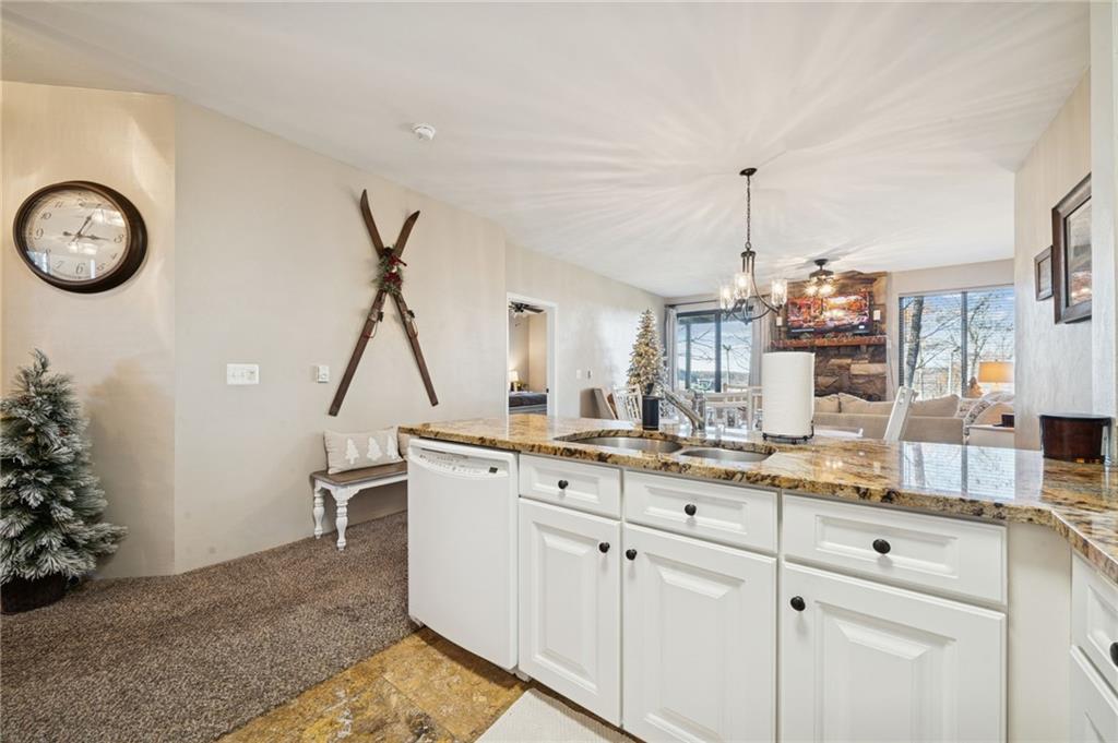 5023 Summit View Court Hidden Valley, PA 15502 - Photo 9 of 41 a view of a kitchen with kitchen island white cabinets and stainless steel appliances
