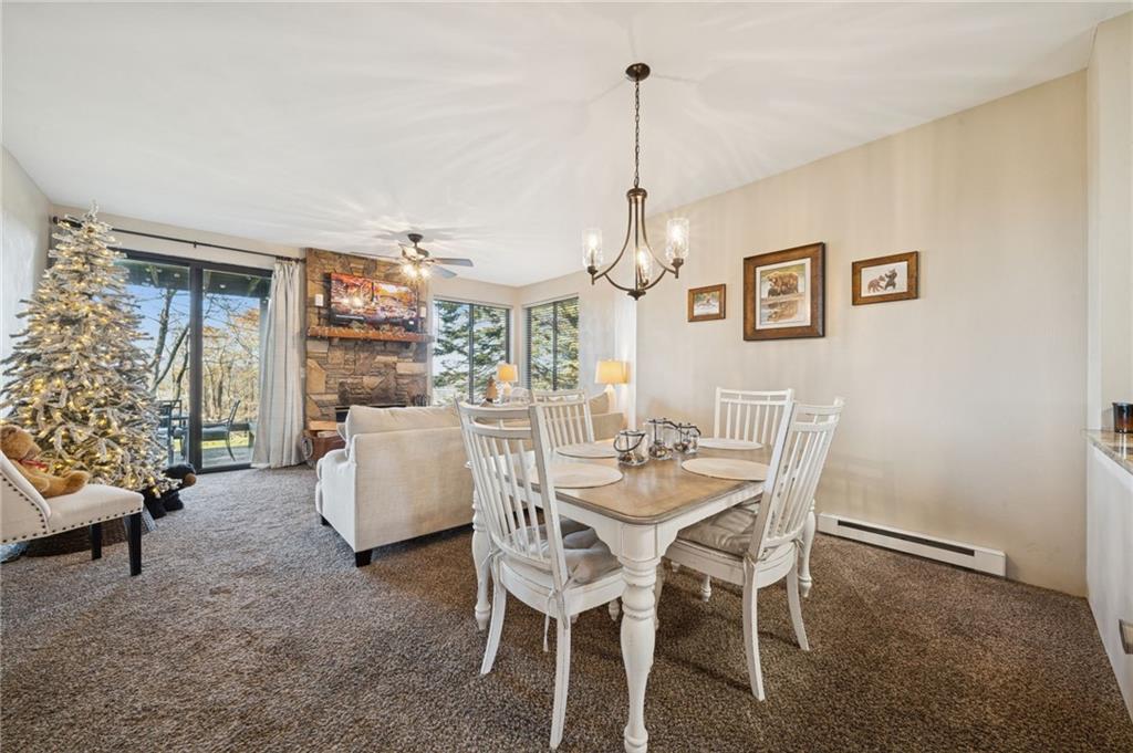 5023 Summit View Court Hidden Valley, PA 15502 - Photo 10 of 41 a view of a dining room with furniture and chandelier