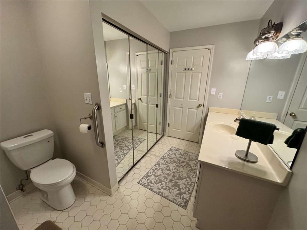 3201 Lenox Road Northeast, Unit 2 Atlanta, GA 30324 - Photo 15 of 39 a bathroom with a toilet sink and shower