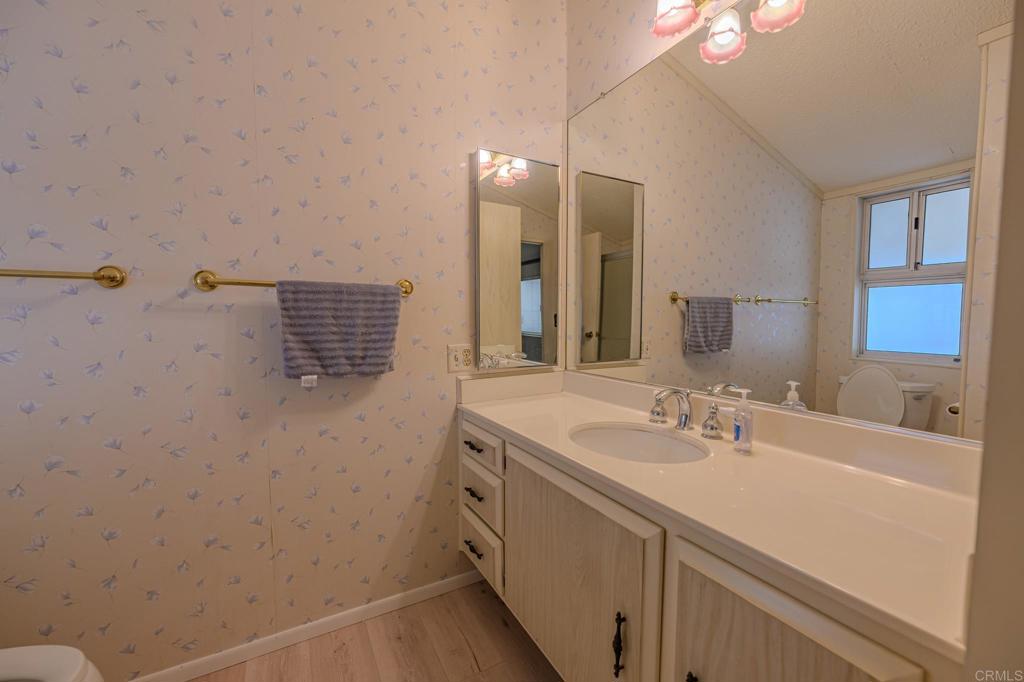 4650 Dulin Road, Unit 153 Fallbrook, CA 92003 - Photo 12 of 24 a bathroom with a sink and a mirror