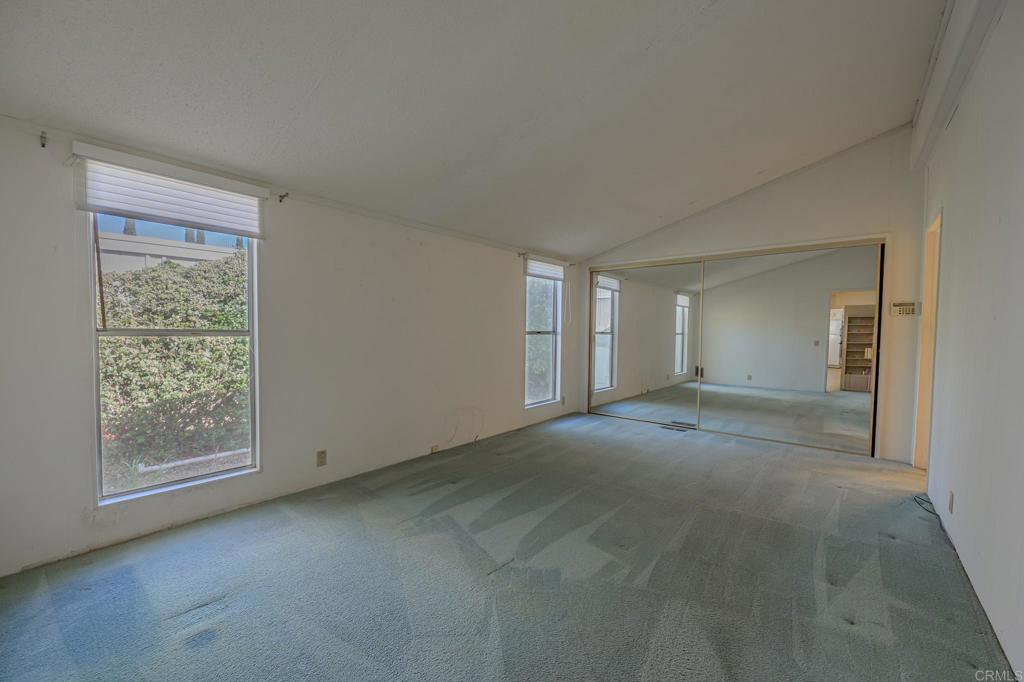 4650 Dulin Road, Unit 153 Fallbrook, CA 92003 - Photo 13 of 24 a view of an empty room with a window